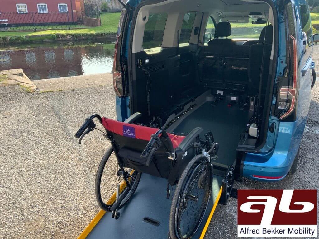 Ford Tourneo Connect Grand XL with seats folded forward showing a wheelchair on the ramp
